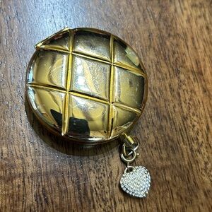Rare vintage Estée Lauder Lucidity Gold Powder Compact with diamond heart charm